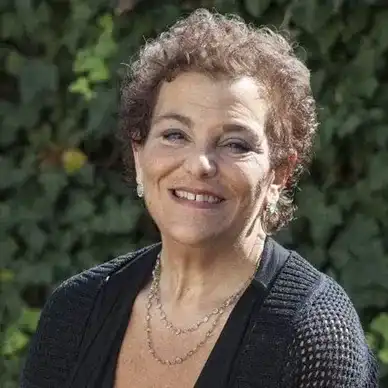 Portrait of Marylou, a professional stylist at hair, showcasing their expertise and style.