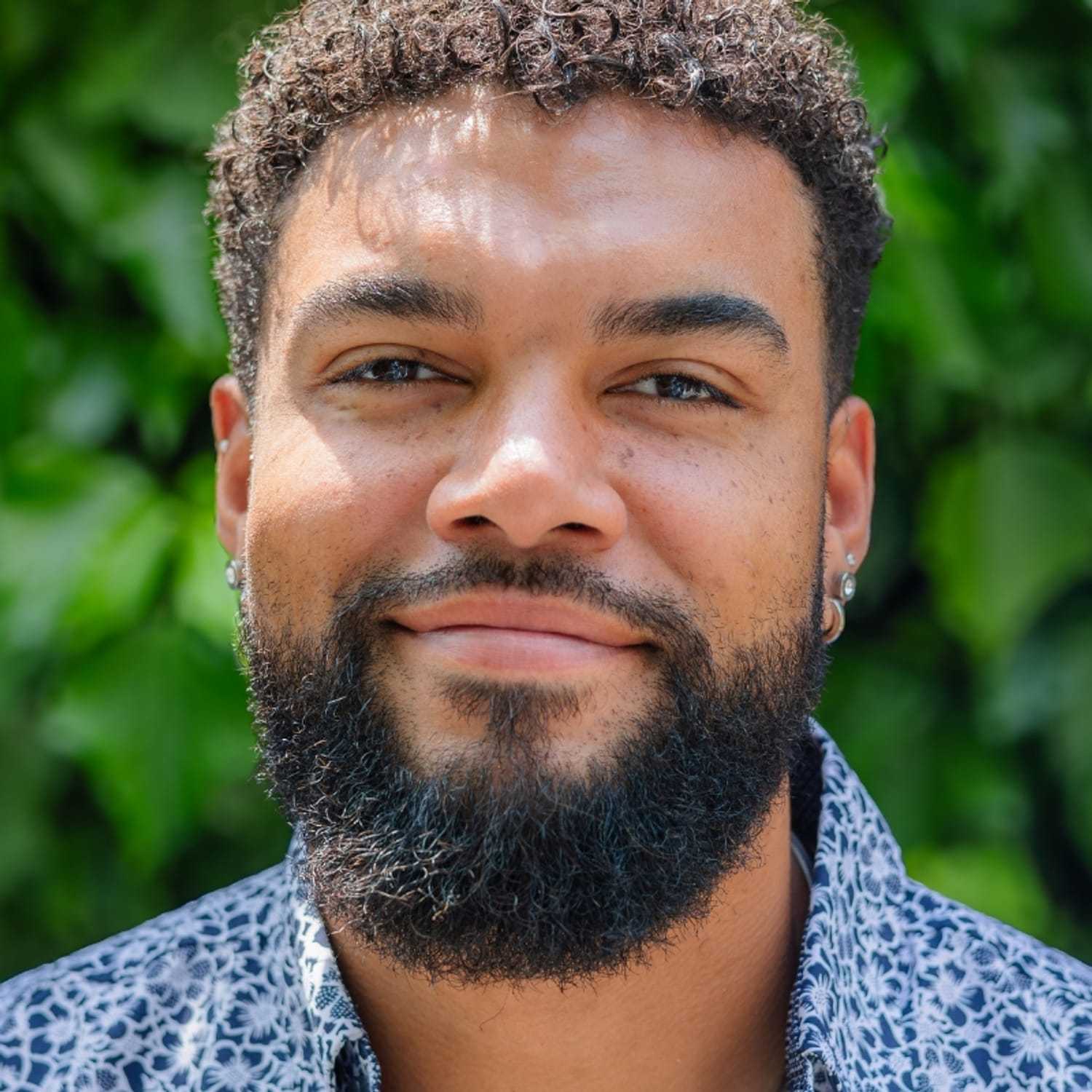 Portrait of Kevin, a professional stylist at hair, showcasing their expertise and style.