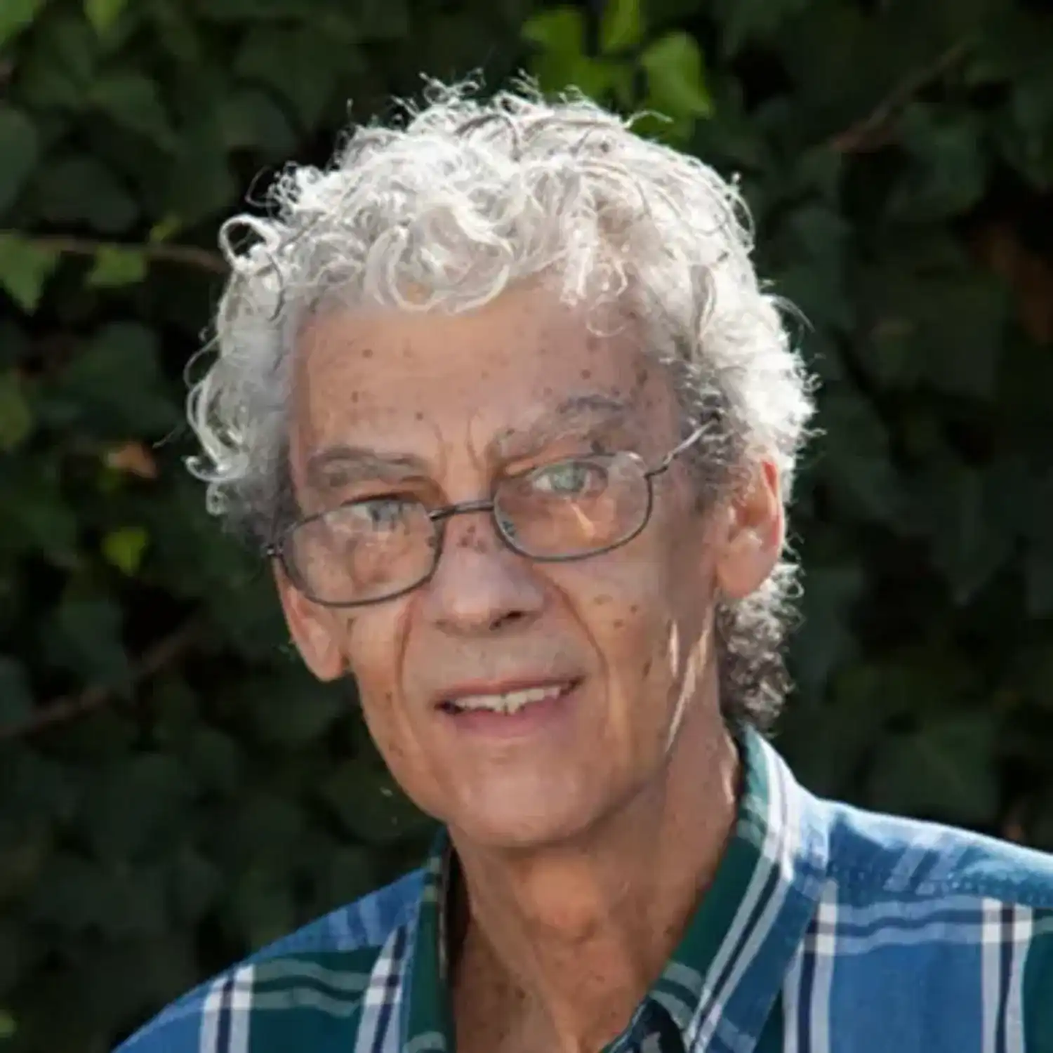 Portrait of Nick, a professional stylist at hair, showcasing their expertise and style.