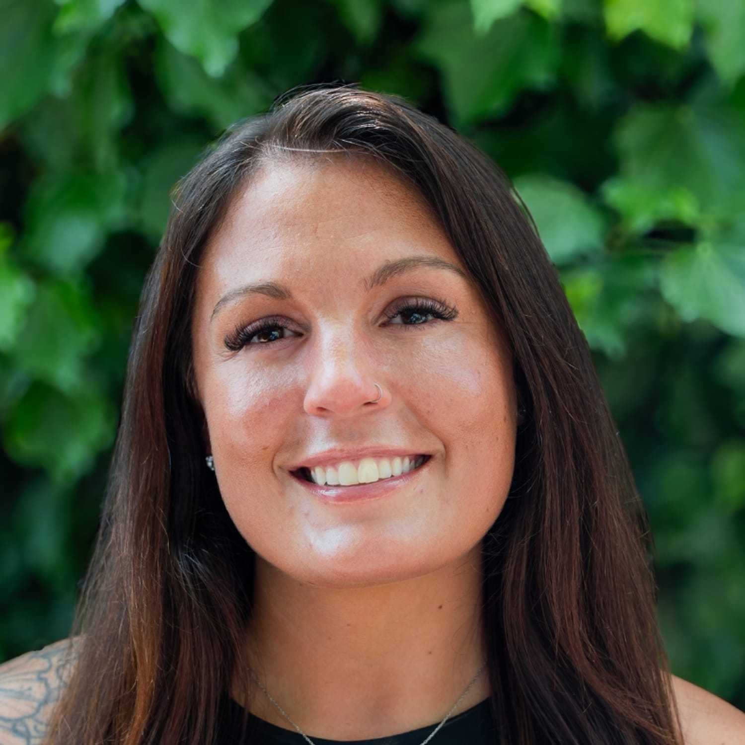 Portrait of Samantha, a professional stylist at hair, showcasing their expertise and style.