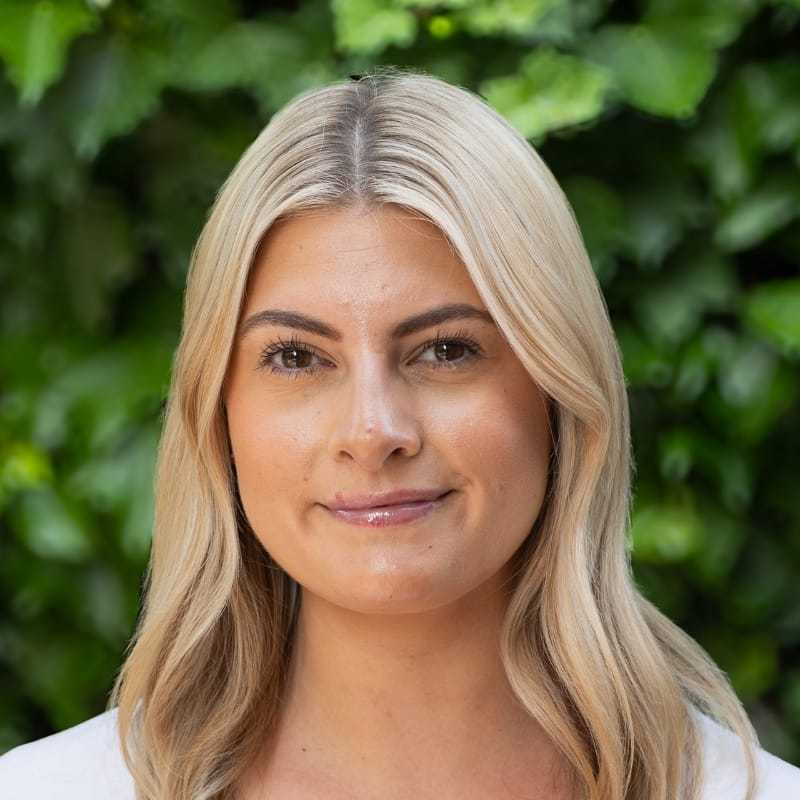 Portrait of Christen, a professional stylist at hair, showcasing their expertise and style.