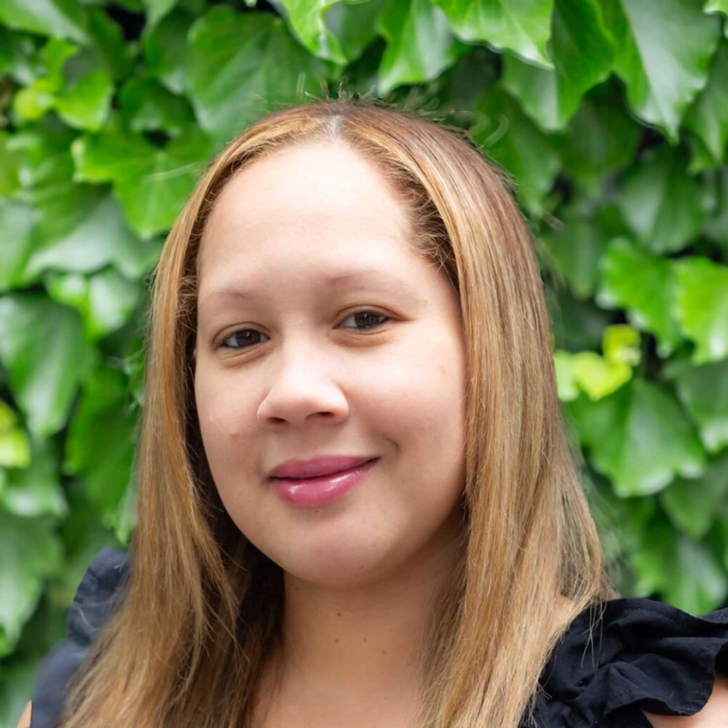 Portrait of Dabrina, a professional stylist at hair, showcasing their expertise and style.