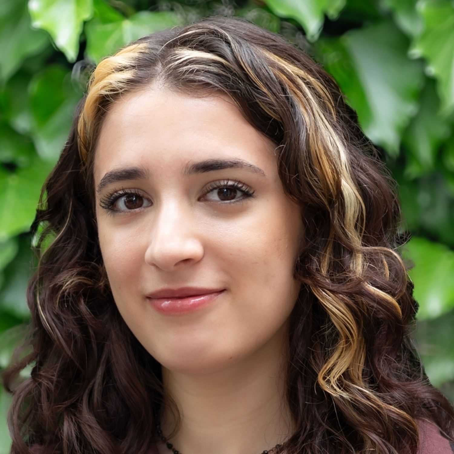 Portrait of Juliette, a professional stylist at hair, showcasing their expertise and style.