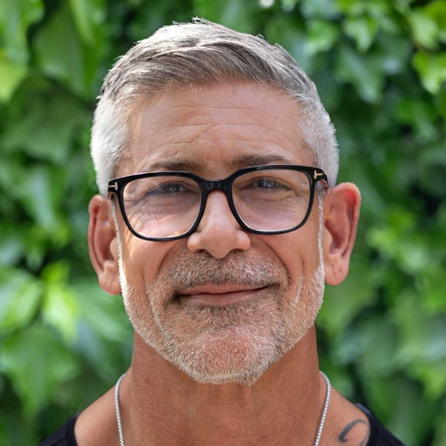 Portrait of Yogi, a professional stylist at hair, showcasing their expertise and style.