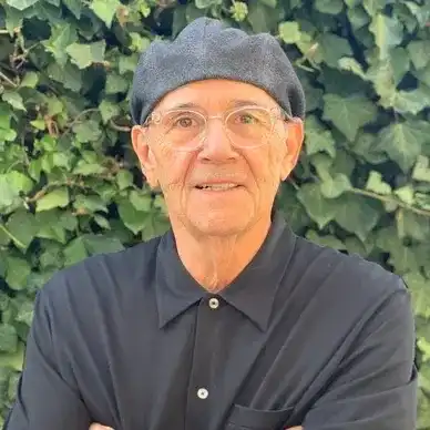 Portrait of Charles, a professional stylist at hair, showcasing their expertise and style.