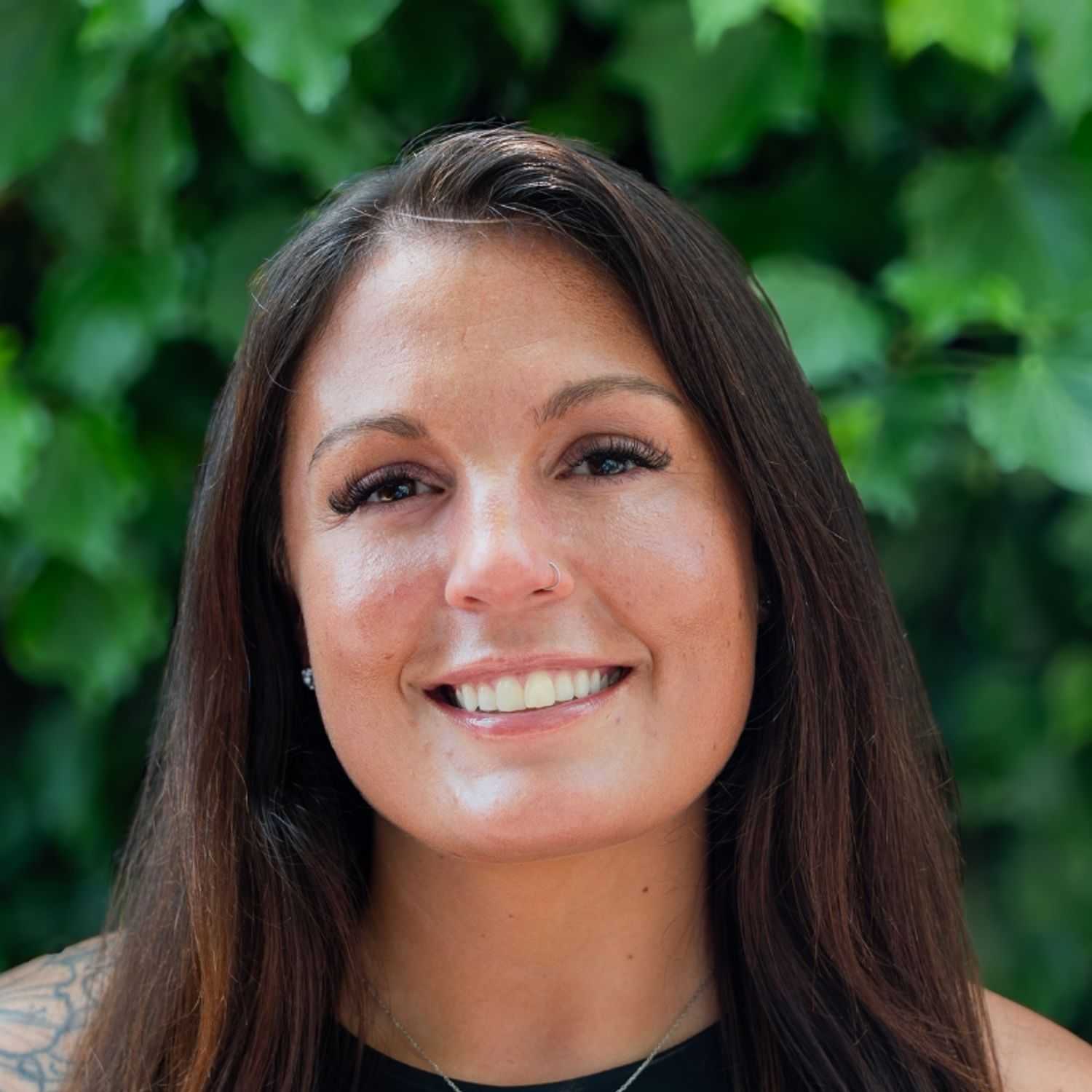 Portrait of Samantha, a professional stylist at hair, showcasing their expertise and style.