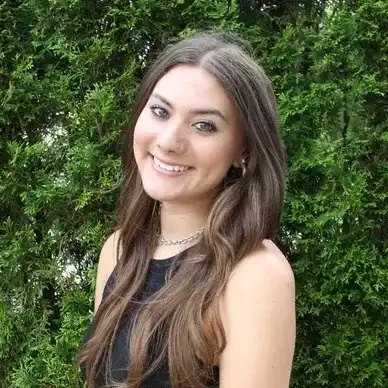 Portrait of Alexis, a professional stylist at hair, showcasing their expertise and style.