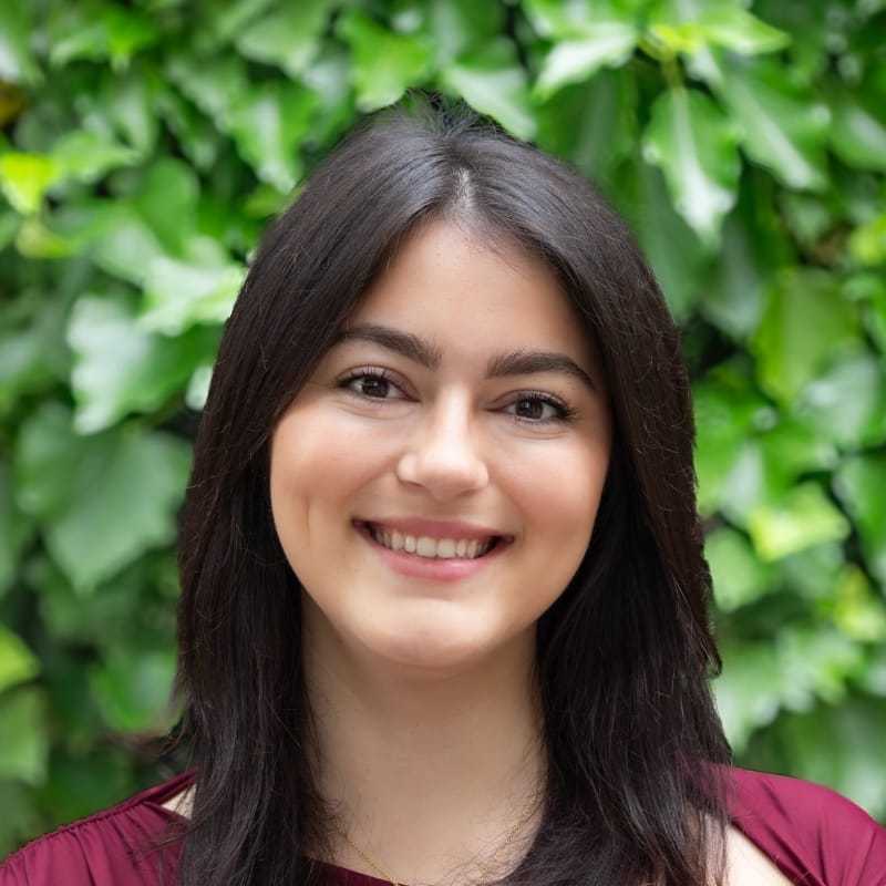 Portrait of Vlora, a professional stylist at hair, showcasing their expertise and style.